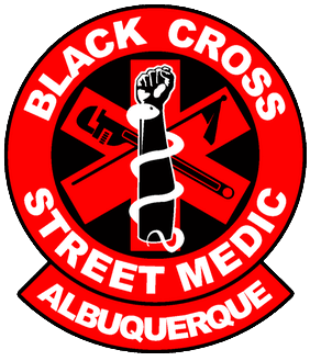 A graphic of the ABQ Black Cross patch, with "Black Cross Street Medic Albuquerque" written around the edges, and a six pointed medical star in the center. Overlaid on the star is a flag and wrench crossed, and a serpent wrapped around a raised fist.